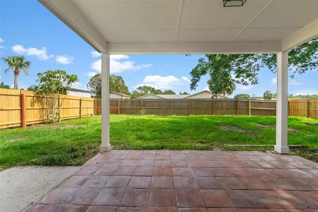 a view of backyard with green space