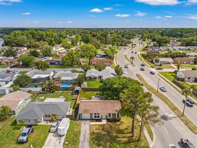 an aerial view of residential houses with outdoor space