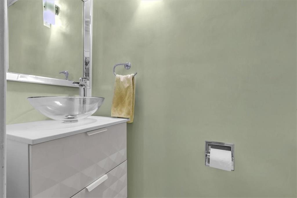 136 Fairfax Road Pittsburgh, PA 15221 - Photo 17 of 50 a bathroom with a sink and a mirror