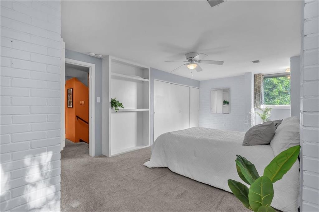136 Fairfax Road Pittsburgh, PA 15221 - Photo 19 of 50 a bedroom with a bed and a painting on the wall