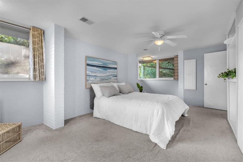 136 Fairfax Road Pittsburgh, PA 15221 - Photo 21 of 50 a spacious bedroom with a bed and a painting on the wall