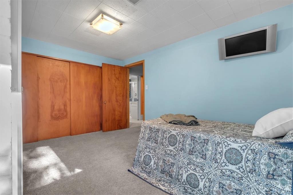 136 Fairfax Road Pittsburgh, PA 15221 - Photo 23 of 50 a bedroom with a bed and a tv