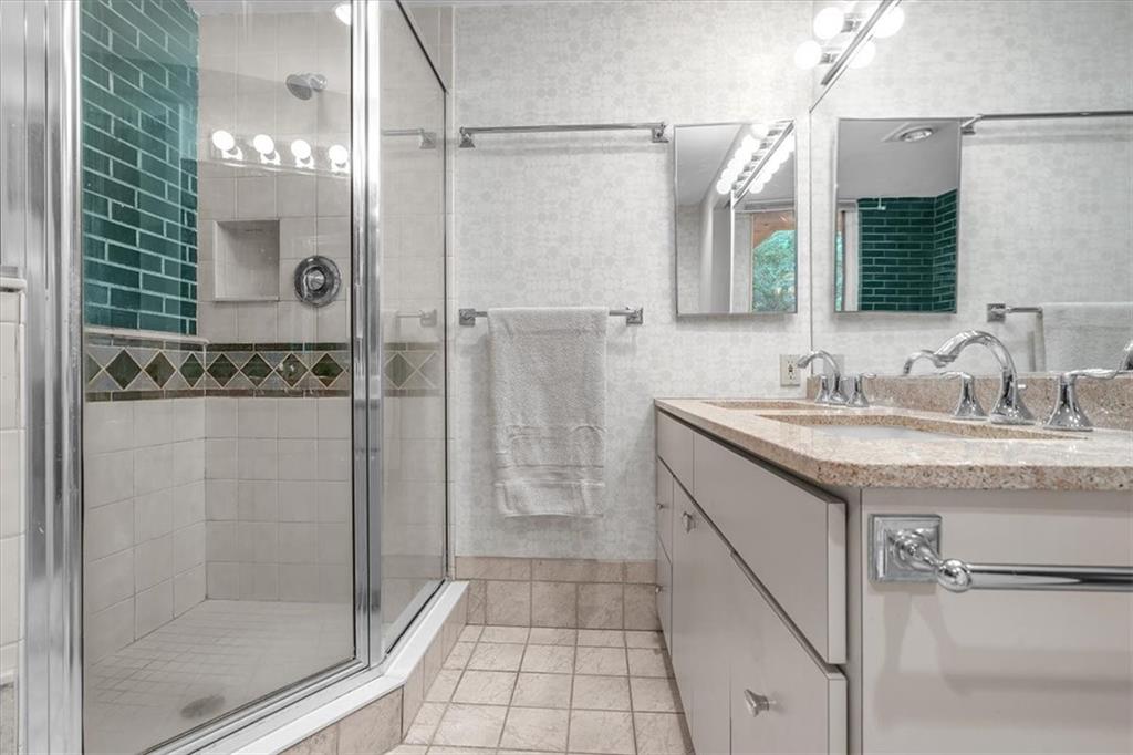 136 Fairfax Road Pittsburgh, PA 15221 - Photo 27 of 50 a bathroom with a granite countertop sink a shower and a mirror