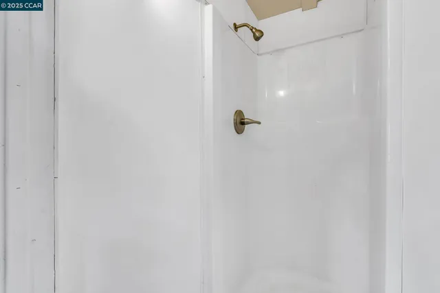 a view of a house with a door and wooden floor