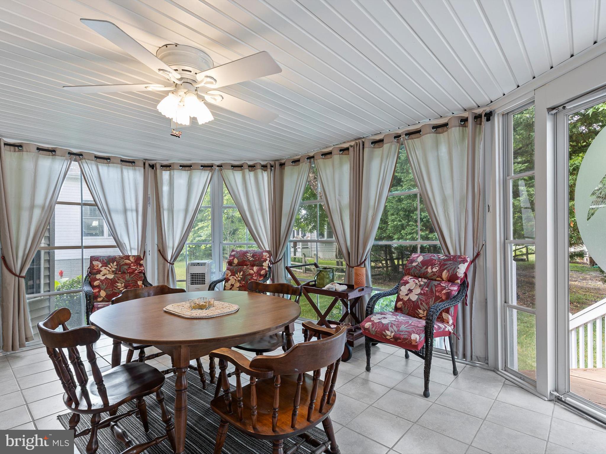 616 Bethany Loop Bethany Beach, DE 19930 - Photo 27 of 57 Enclosed 3-season room with free-standing A/C unit