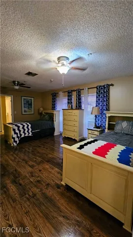 a kitchen with kitchen island granite countertop sink and cabinets