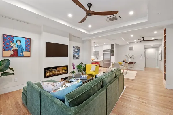 a living room with fireplace furniture and a flat screen tv