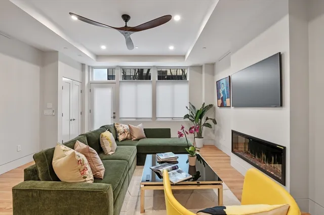 a living room with furniture and a fireplace