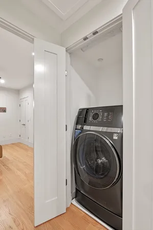 a utility room with washing machine