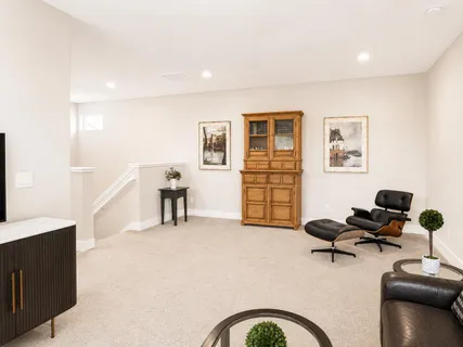 a view of a livingroom with workspace and a couch