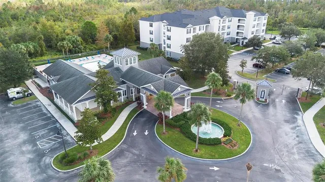 an aerial view of a house with outdoor space