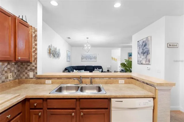 a kitchen with a sink and cabinets