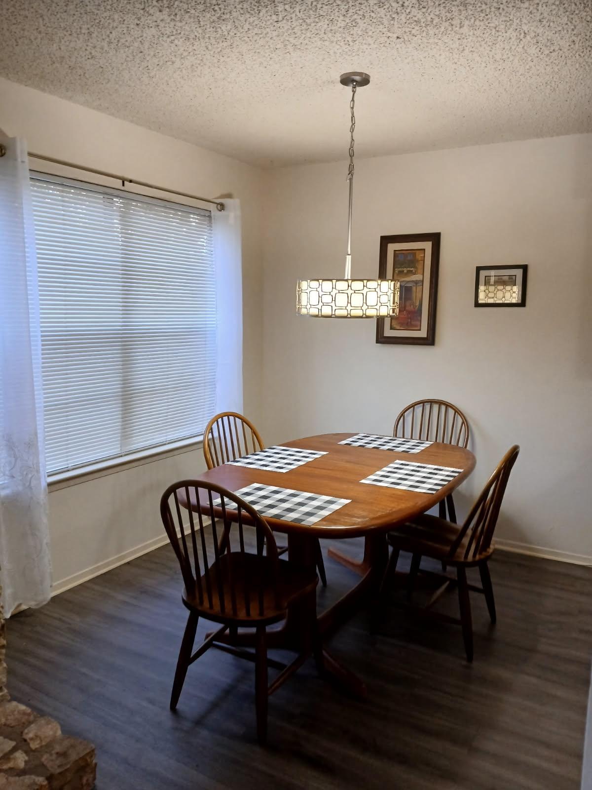 12905 Pegasus Street Austin, TX 78727 - Photo 17 of 32 a dining room with furniture and wooden floor