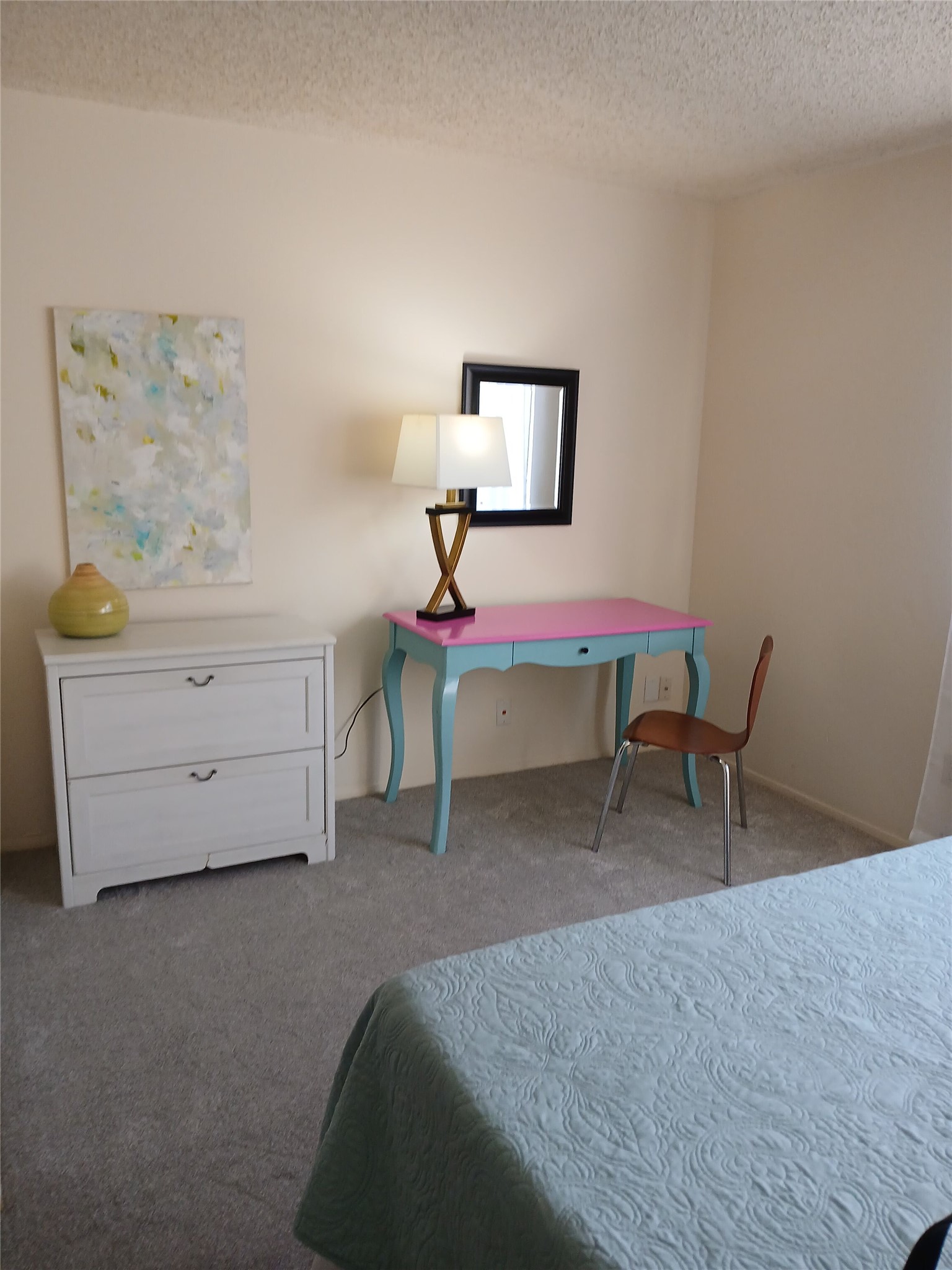 12905 Pegasus Street Austin, TX 78727 - Photo 19 of 32 a bedroom with a bed and a table in it