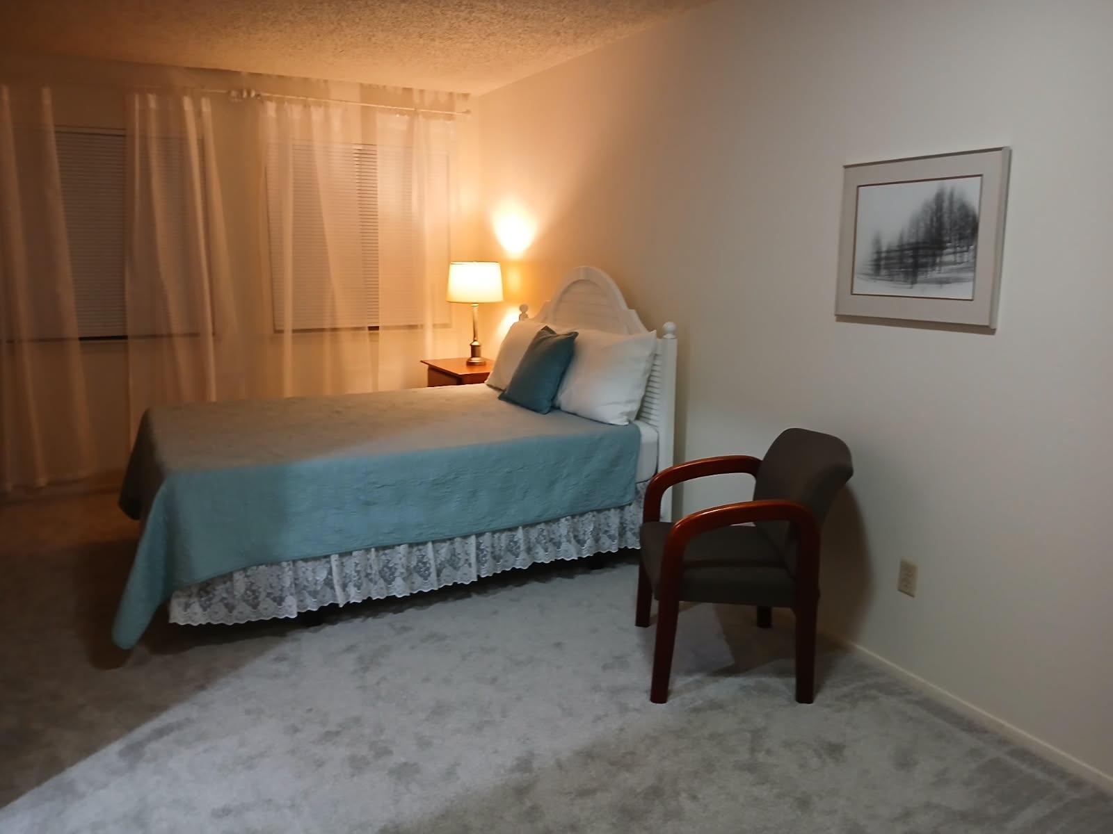 12905 Pegasus Street Austin, TX 78727 - Photo 21 of 32 a bedroom with a bed and a chair