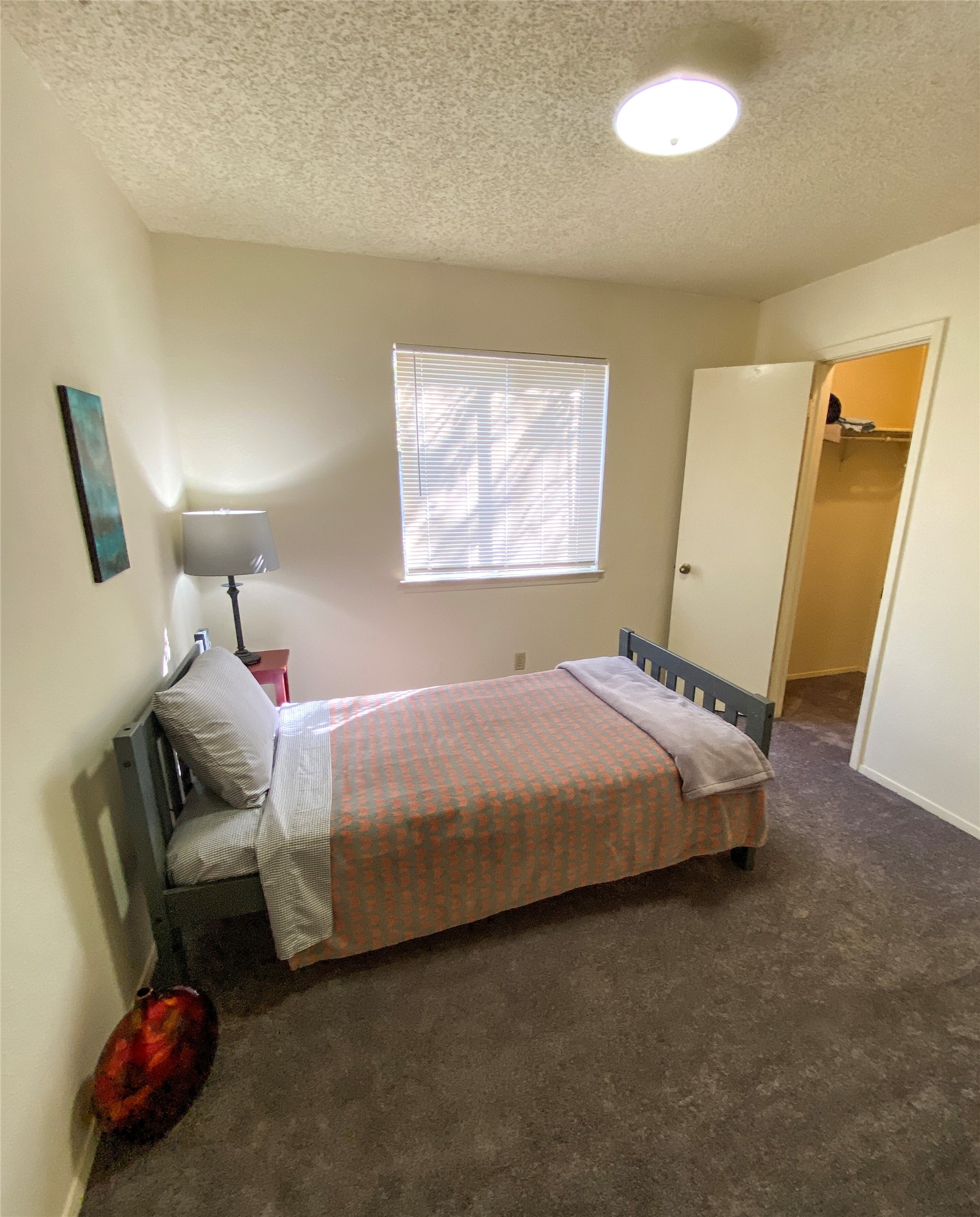 12905 Pegasus Street Austin, TX 78727 - Photo 24 of 32 a bedroom with a bed and a couch