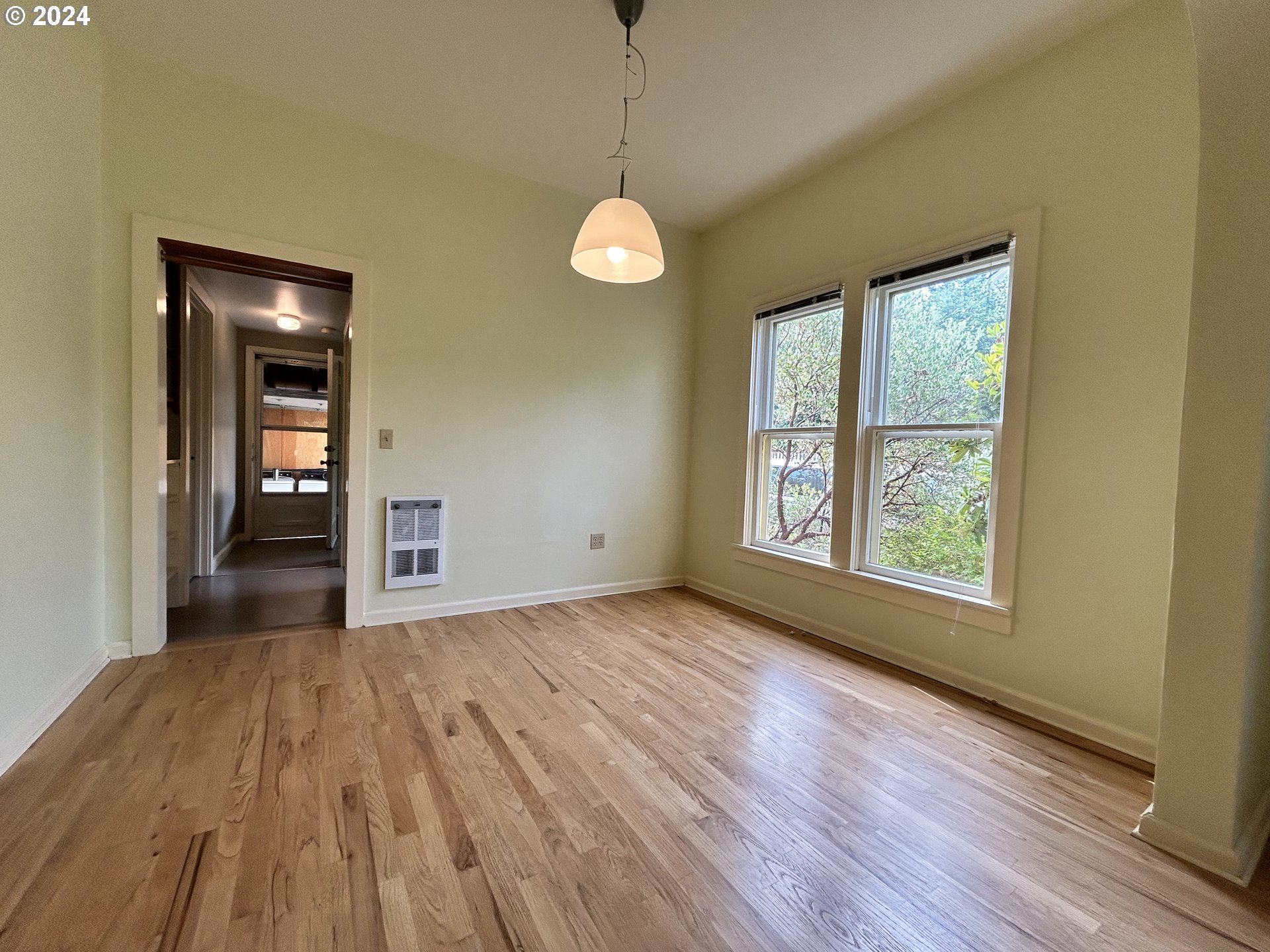 329 5th Street Springfield, OR 97477 - Photo 11 of 35 a view of a room with wooden floor and windows