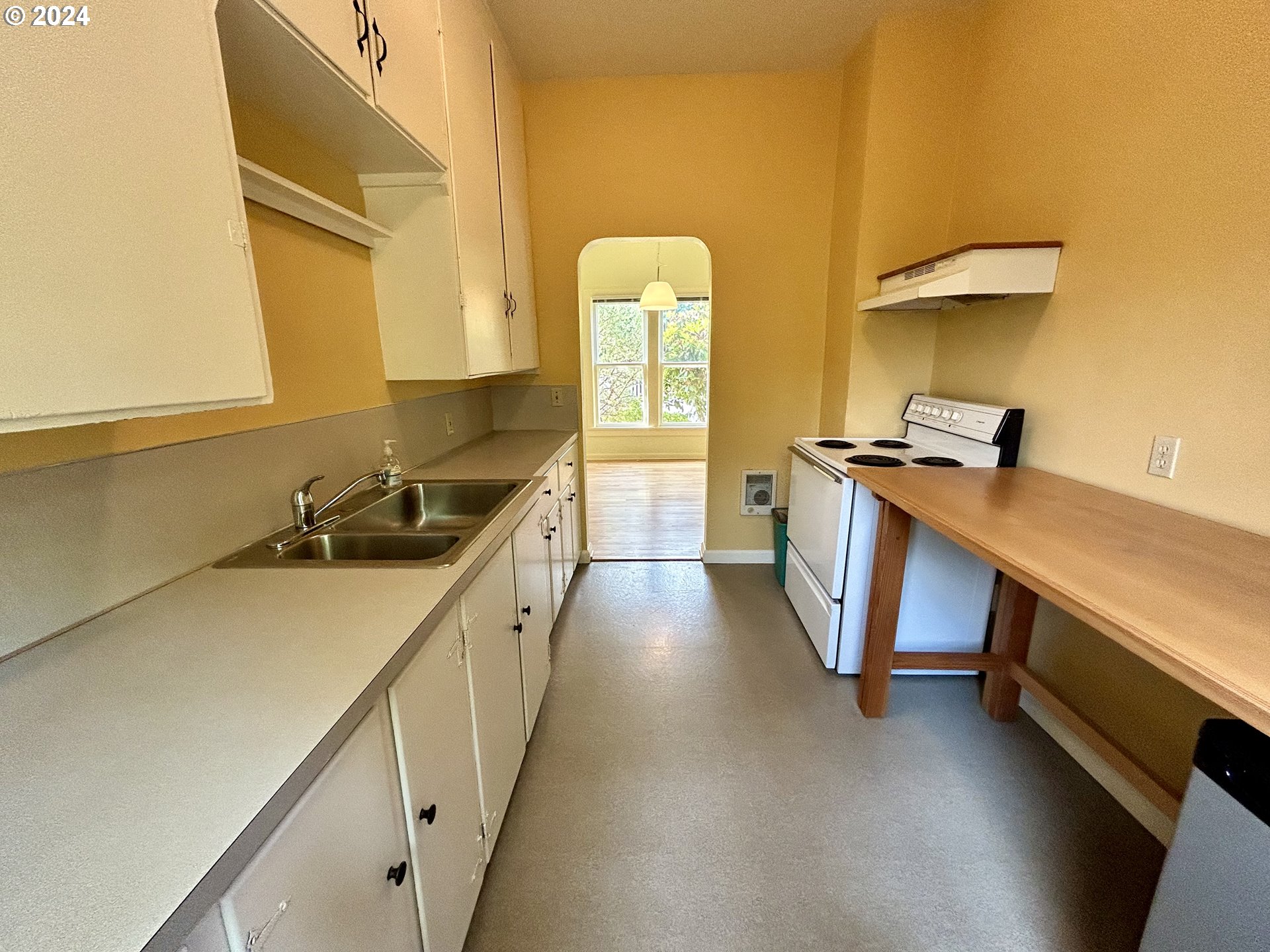 329 5th Street Springfield, OR 97477 - Photo 12 of 35 a kitchen with a sink and a stove top oven