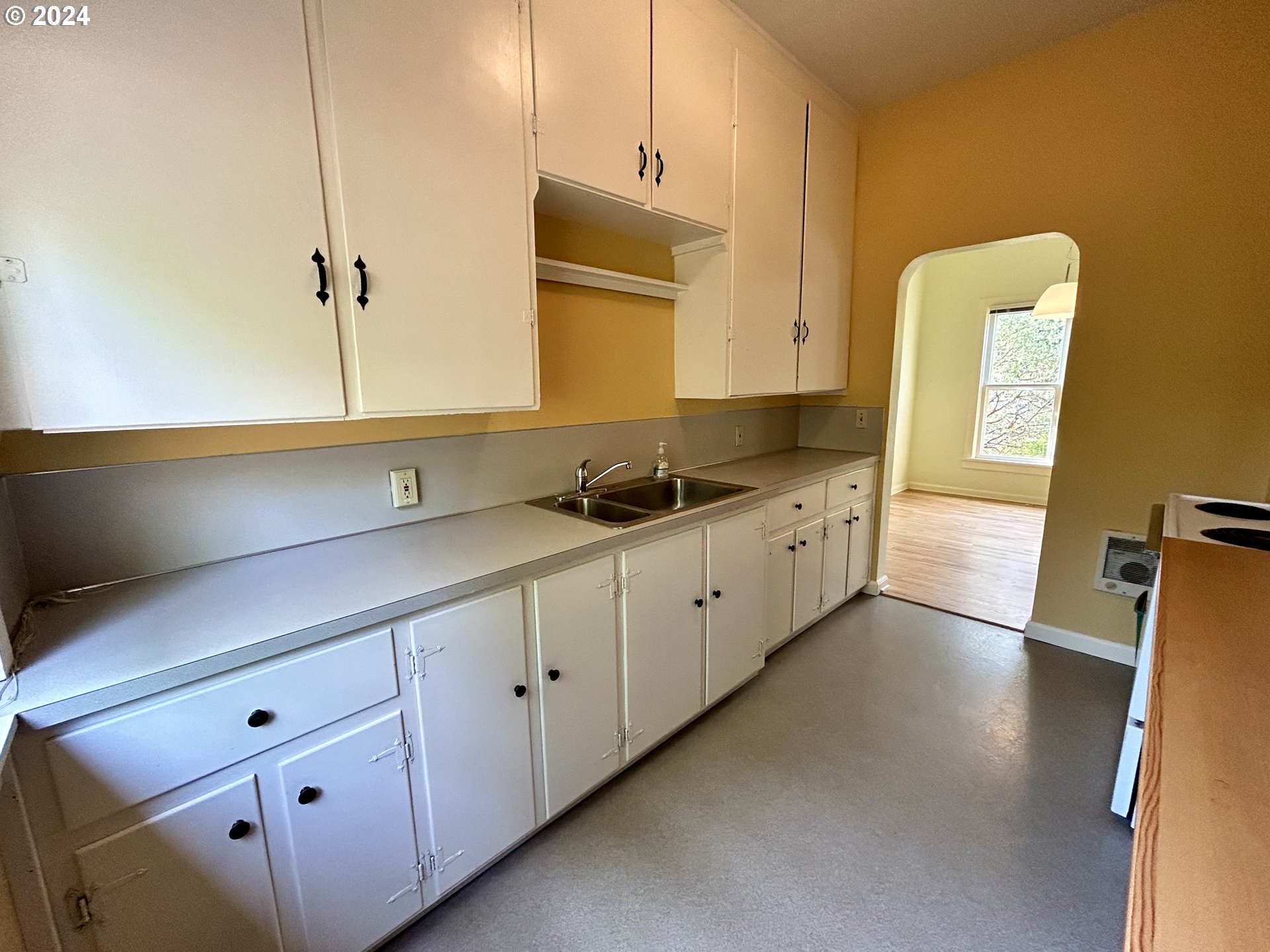 329 5th Street Springfield, OR 97477 - Photo 13 of 35 a kitchen with cabinets and window