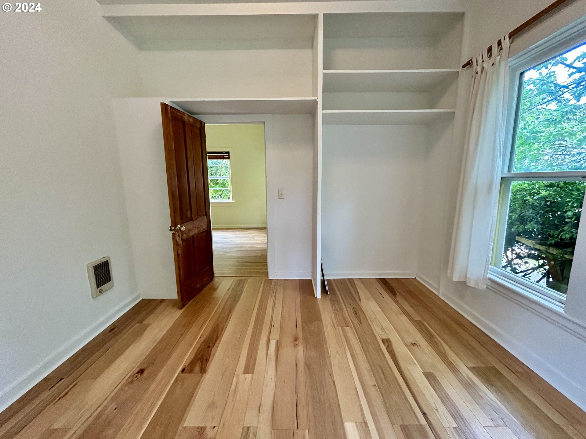 329 5th Street Springfield, OR 97477 - Photo 17 of 35 a view of a room with wooden floor and a window