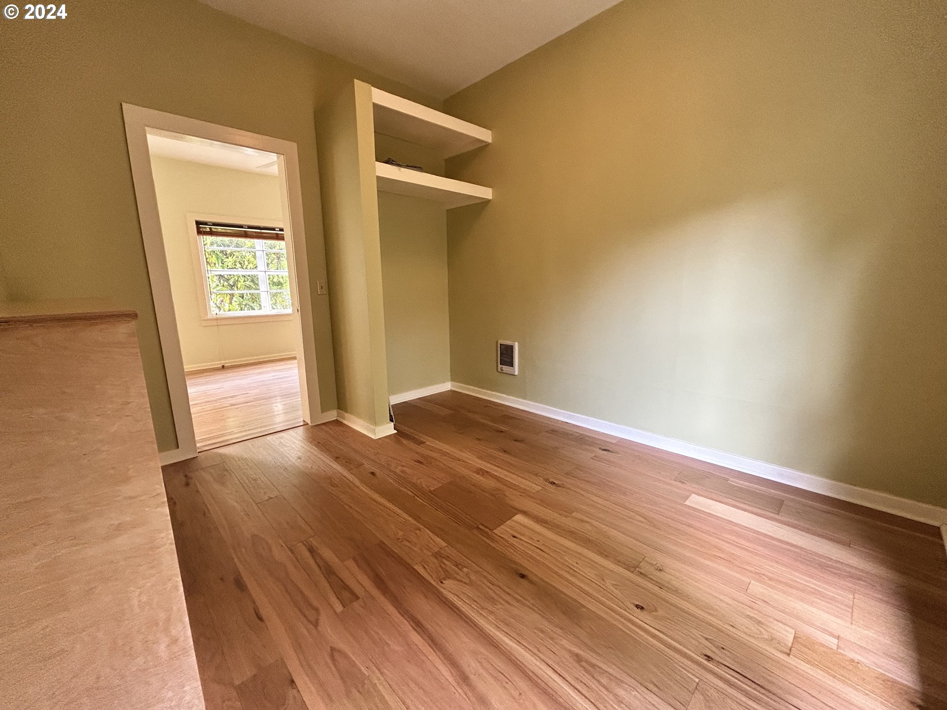 329 5th Street Springfield, OR 97477 - Photo 19 of 35 an empty room with wooden floor and windows