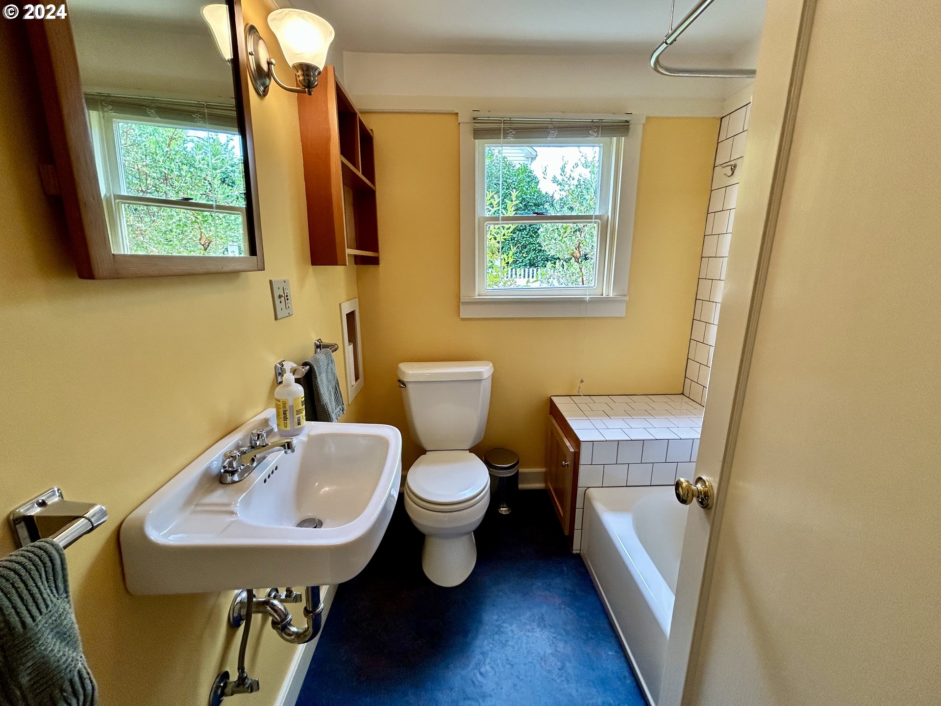 329 5th Street Springfield, OR 97477 - Photo 20 of 35 a bathroom with a toilet sink and mirror