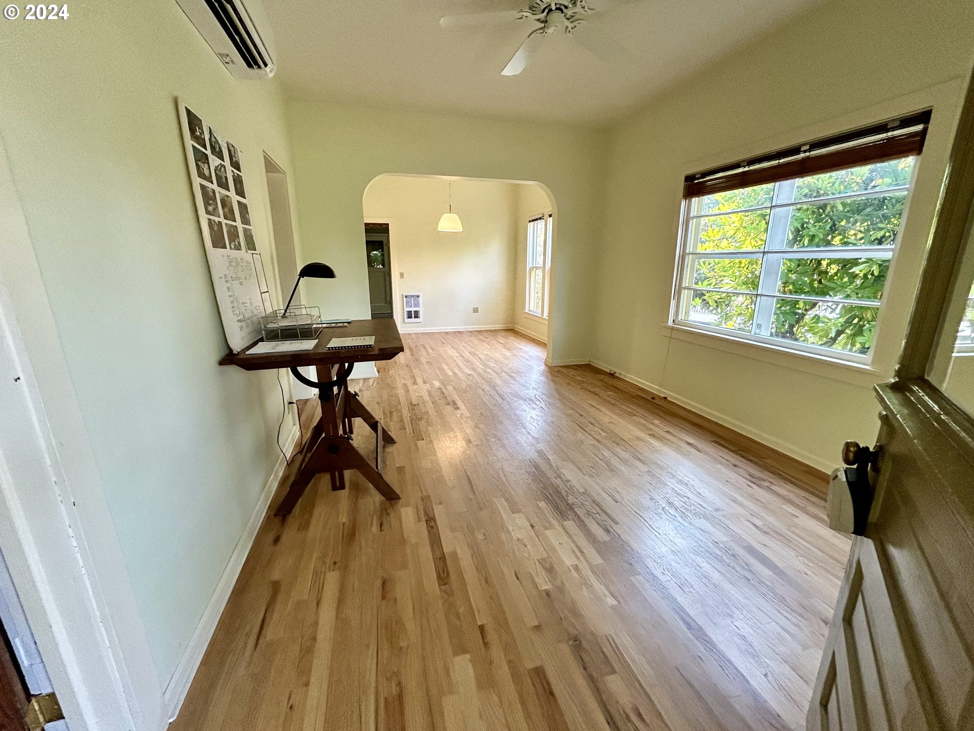 329 5th Street Springfield, OR 97477 - Photo 4 of 35 a view of a hallway with wooden floor and staircase