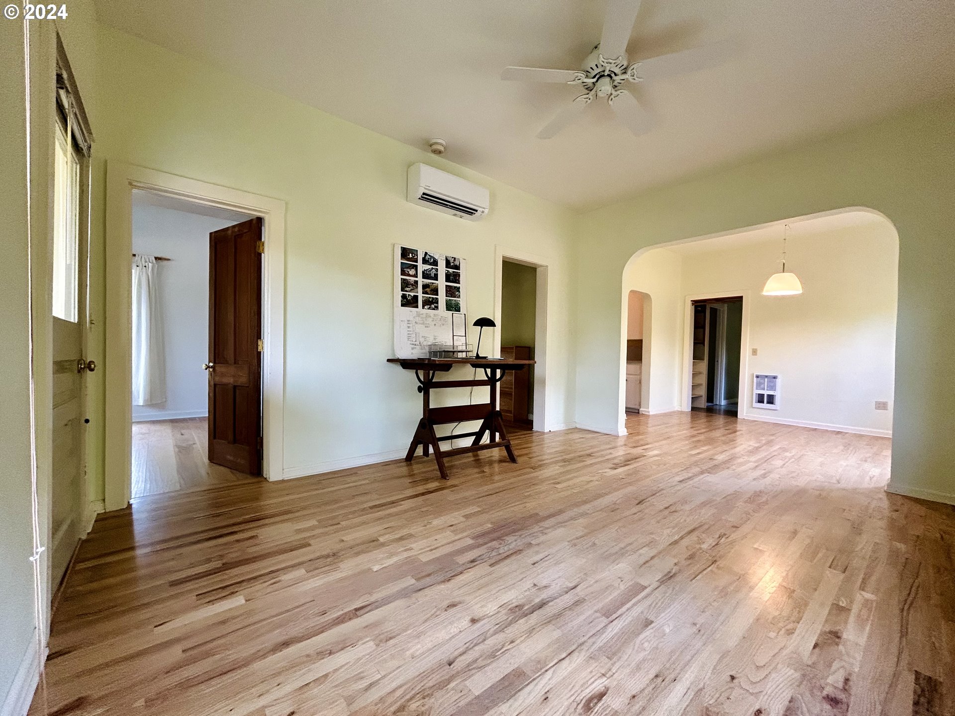 329 5th Street Springfield, OR 97477 - Photo 5 of 35 a view of a livingroom with wooden floor and a ceiling fan