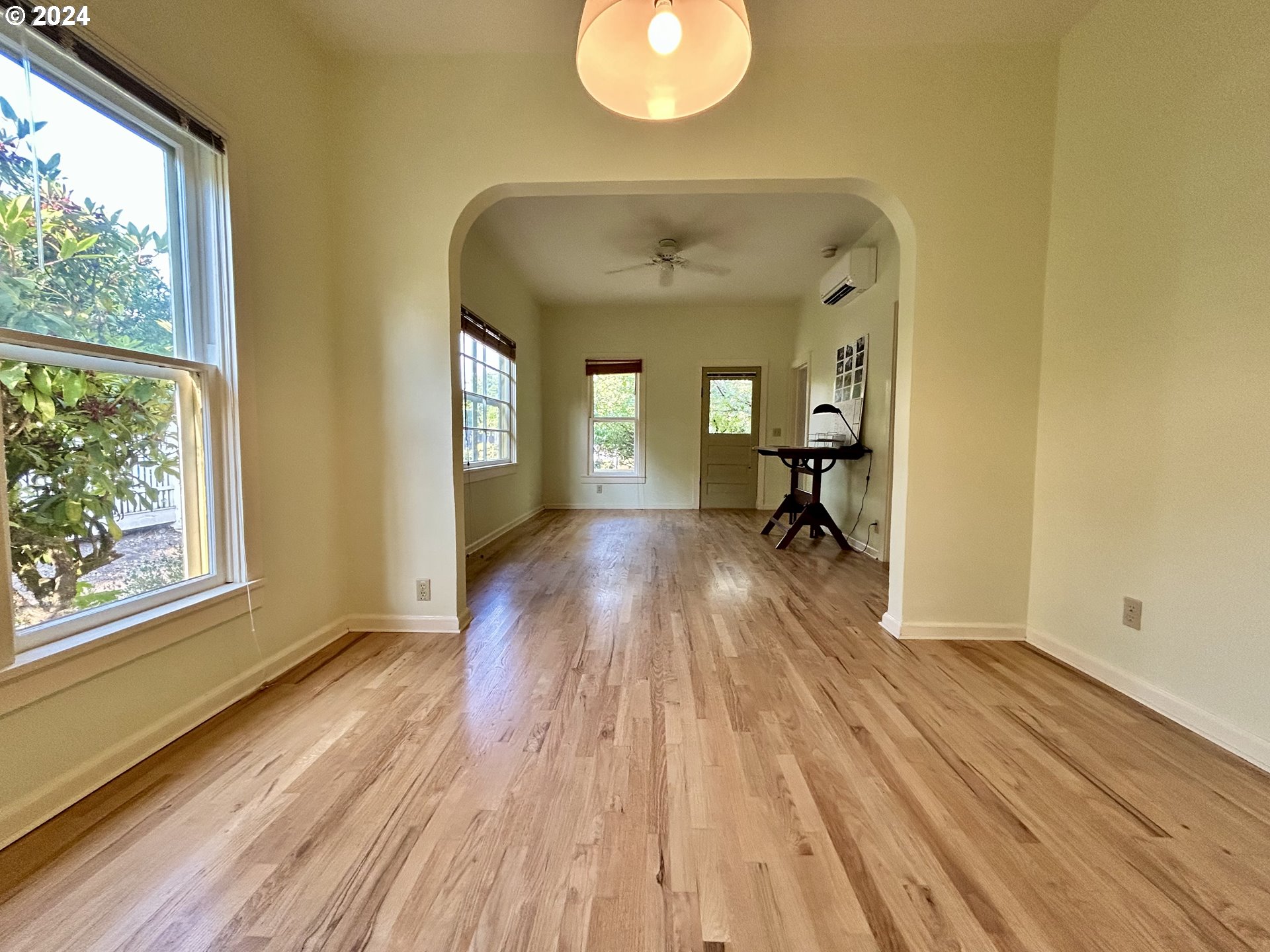 329 5th Street Springfield, OR 97477 - Photo 8 of 35 a view of a living room and bathroom with wooden floor