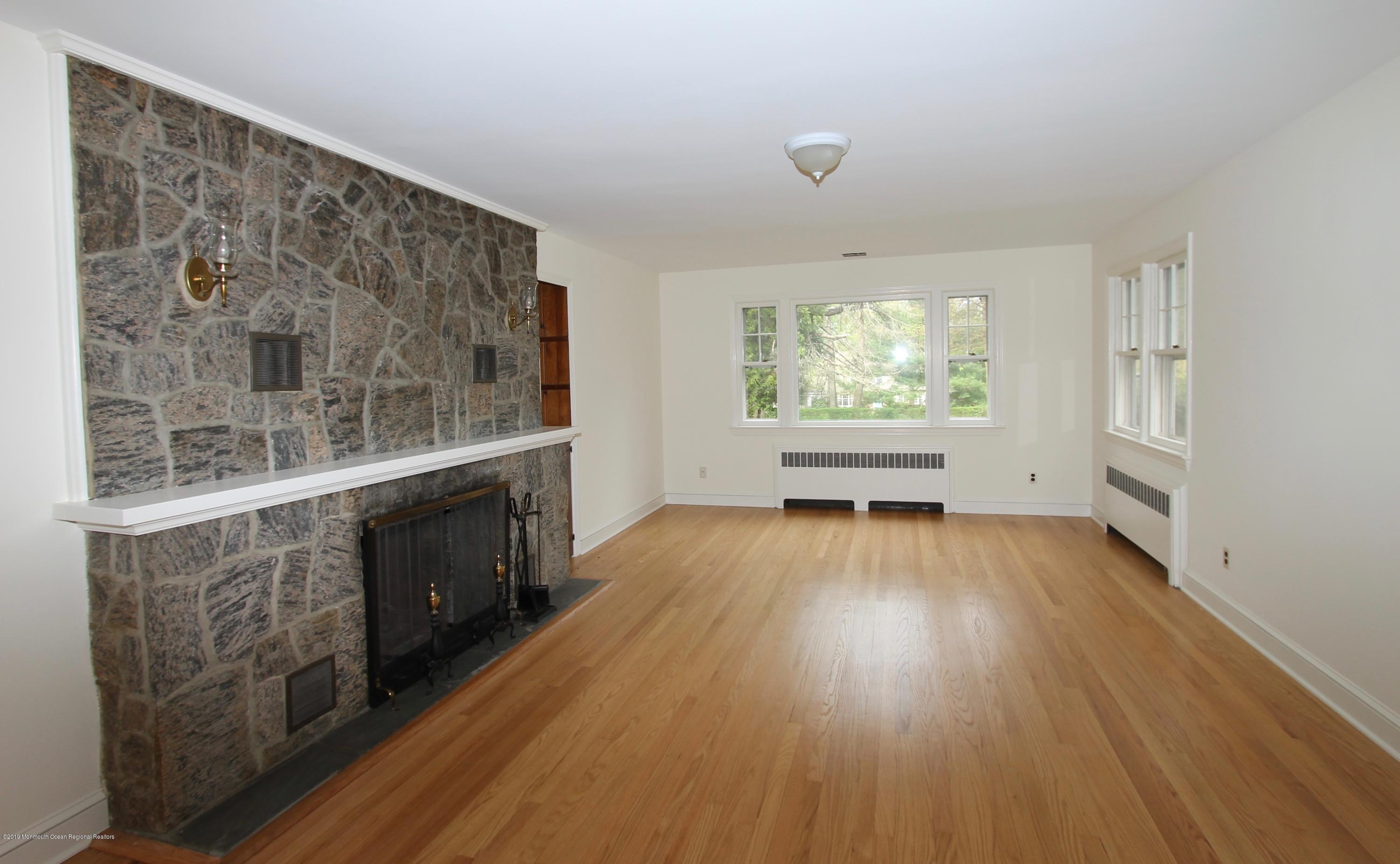 484 Hance Road Little Silver, NJ 07739 - Photo 3 of 22 a view of an empty room with wooden floor and a window