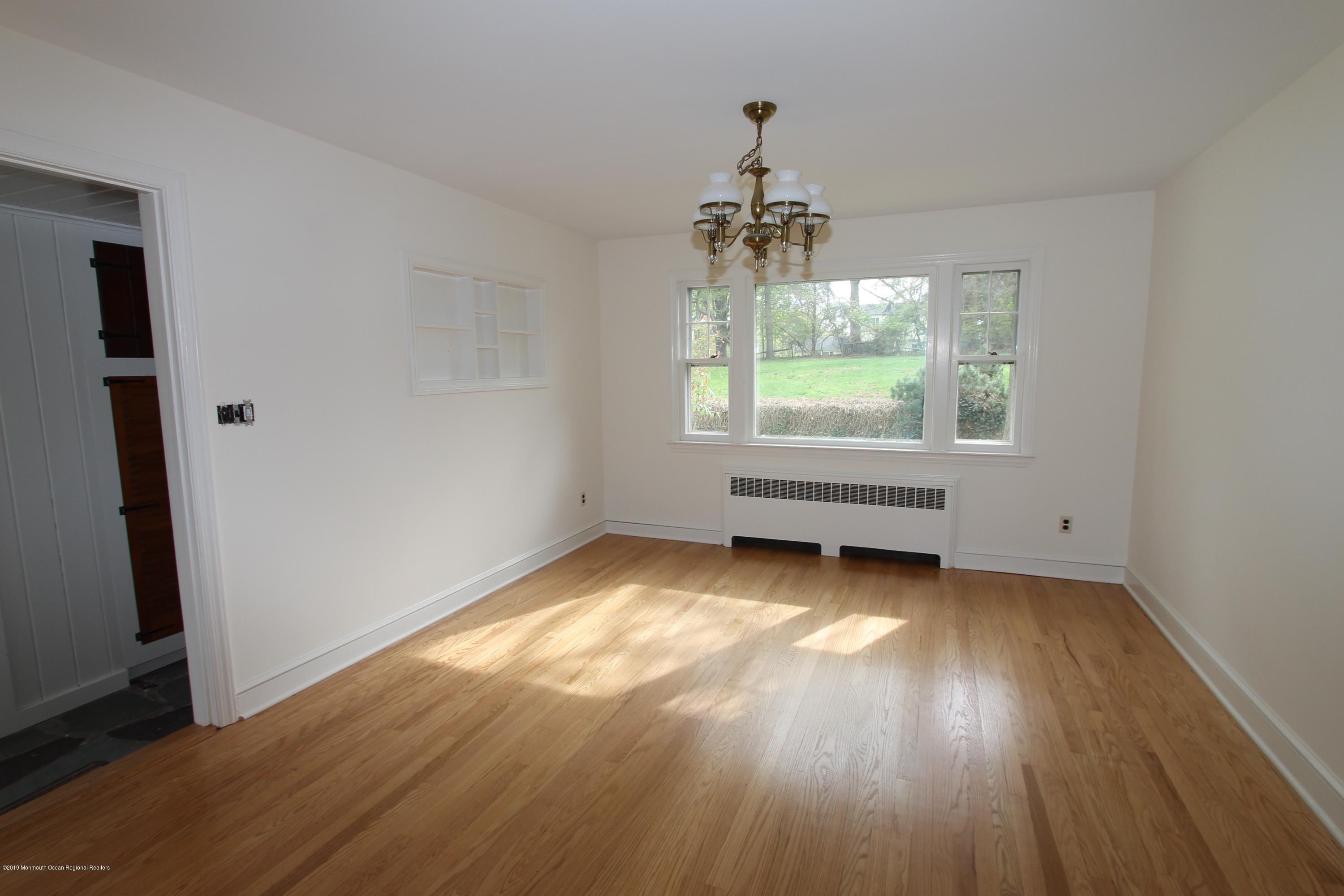 484 Hance Road Little Silver, NJ 07739 - Photo 4 of 22 an empty room with wooden floor and windows