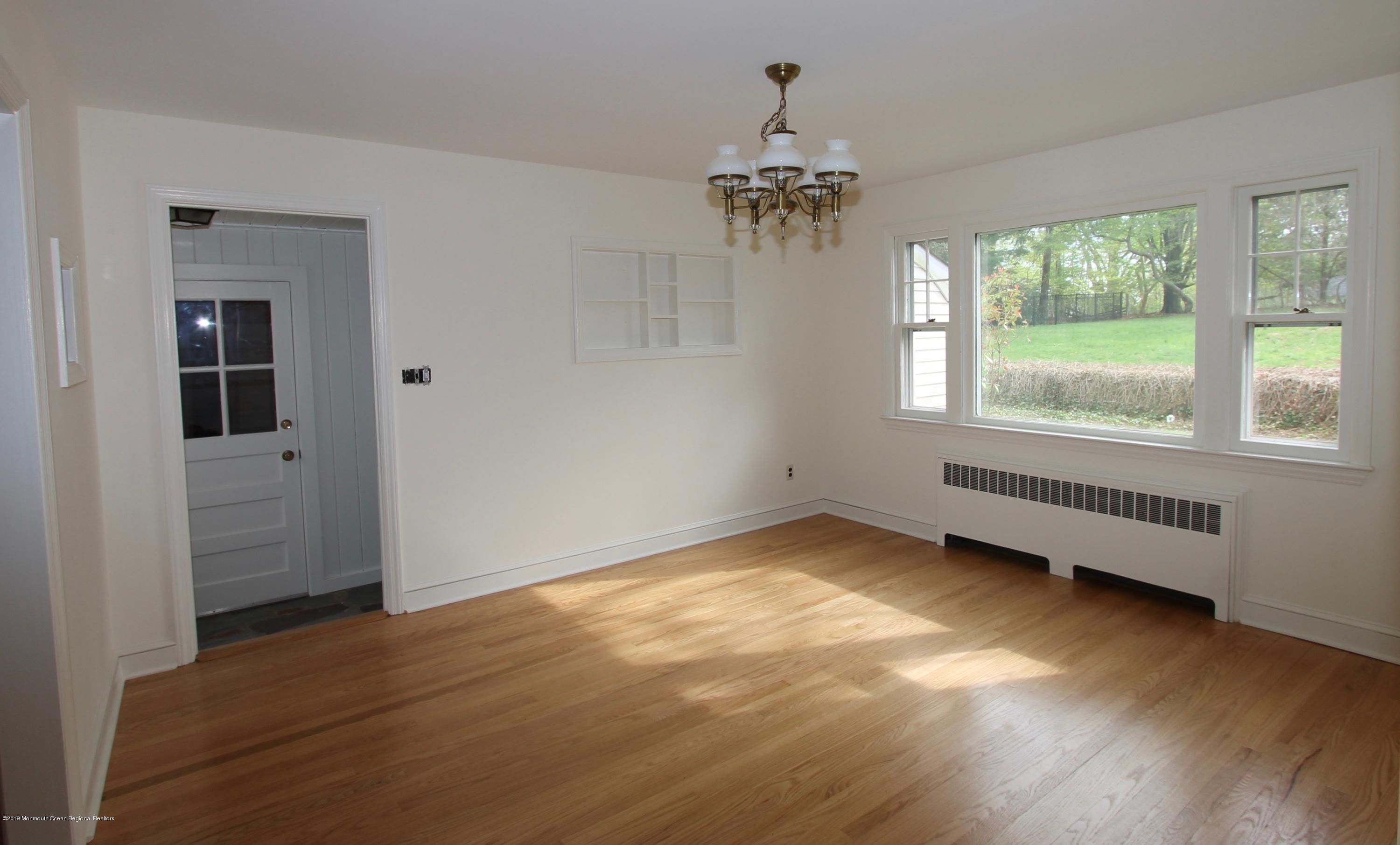 484 Hance Road Little Silver, NJ 07739 - Photo 5 of 22 an empty room with wooden floor and windows