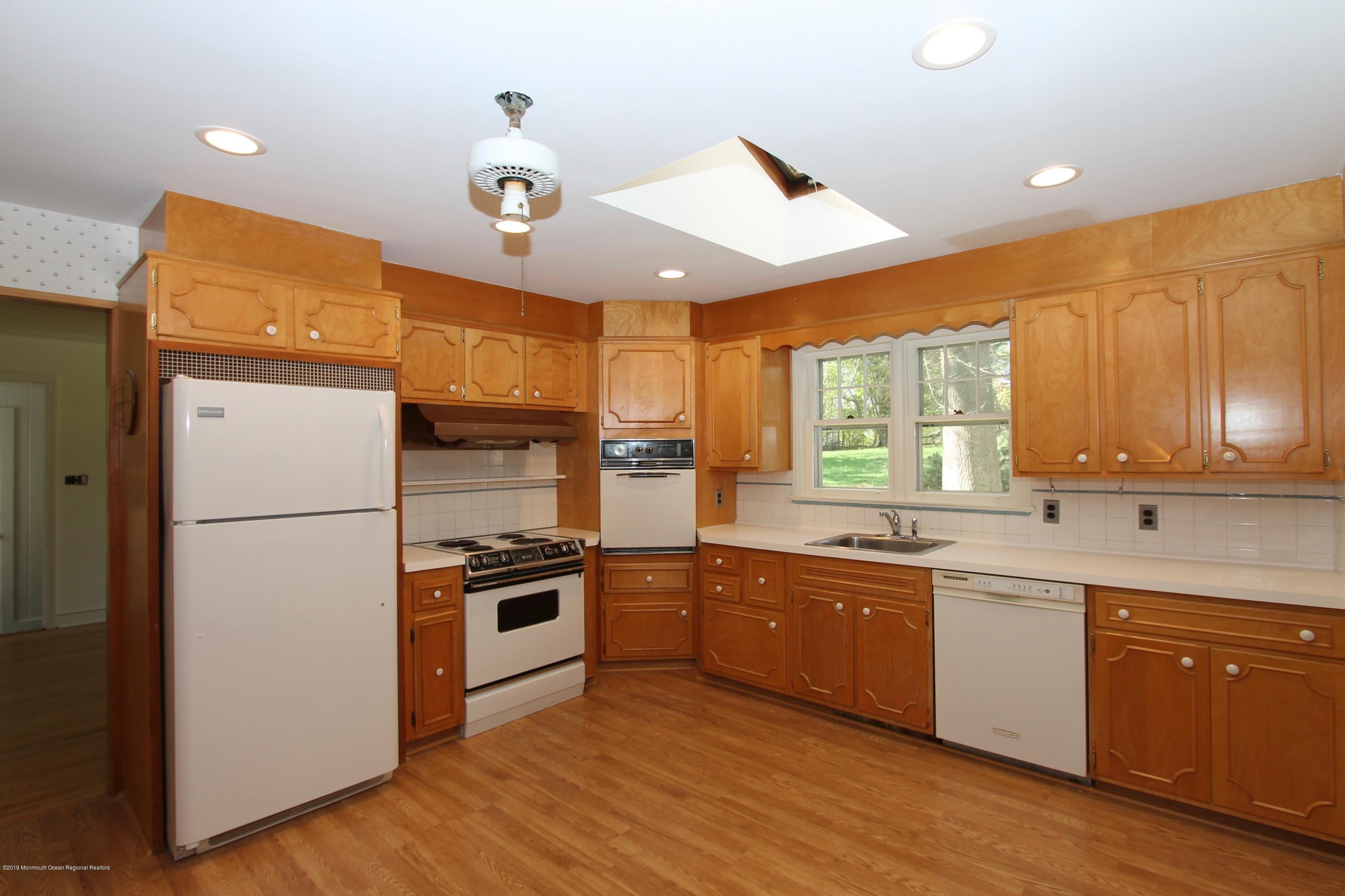 484 Hance Road Little Silver, NJ 07739 - Photo 7 of 22 a kitchen with stainless steel appliances granite countertop a stove a sink and a refrigerator
