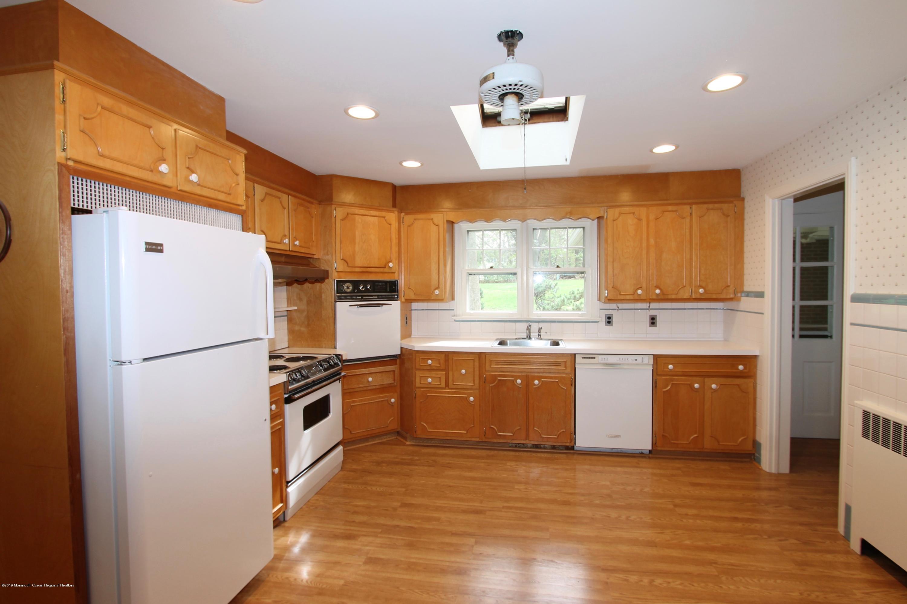 484 Hance Road Little Silver, NJ 07739 - Photo 8 of 22 a kitchen with granite countertop a refrigerator a sink dishwasher with a stove and refrigerator