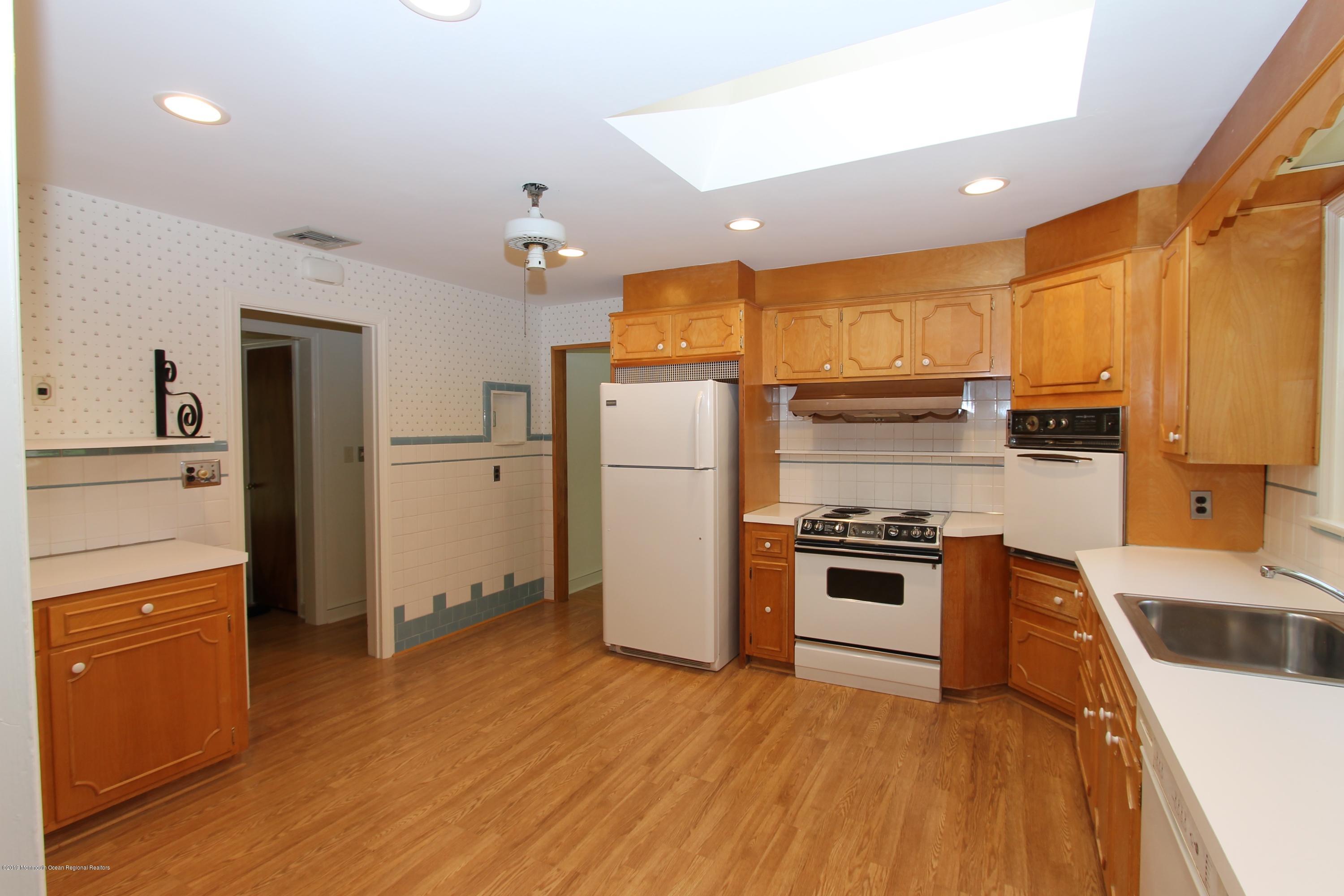 484 Hance Road Little Silver, NJ 07739 - Photo 9 of 22 a kitchen with stainless steel appliances granite countertop a refrigerator a stove top oven a sink and dishwasher