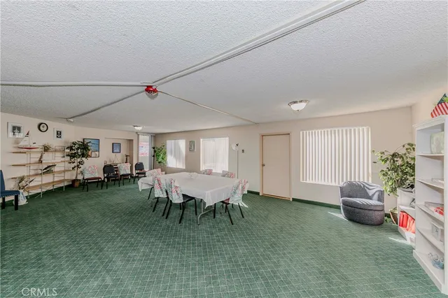 a view of a dining room with furniture and a livingroom