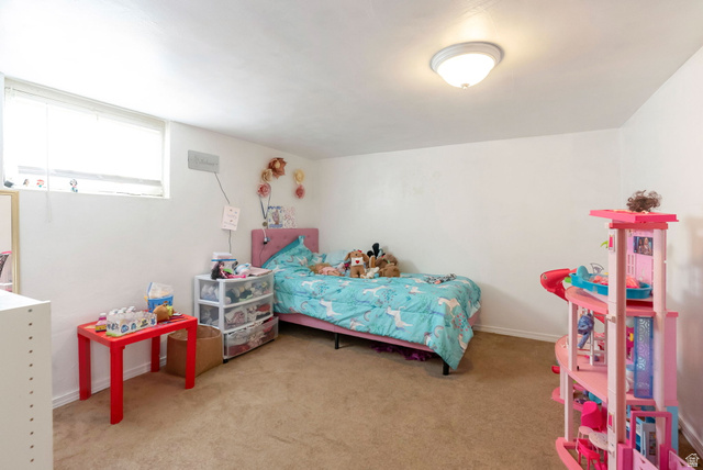 654 North 100 East Logan, UT 84321 - Photo 19 of 41 Bedroom featuring light carpet and baseboards