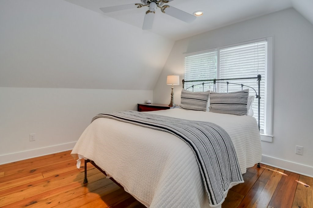 191 North Martintown Road Edgefield, SC 29824 - Photo 44 of 75 a bedroom with a bed and a chandelier