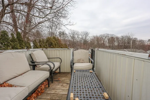 a terrace of a house with outdoor seating