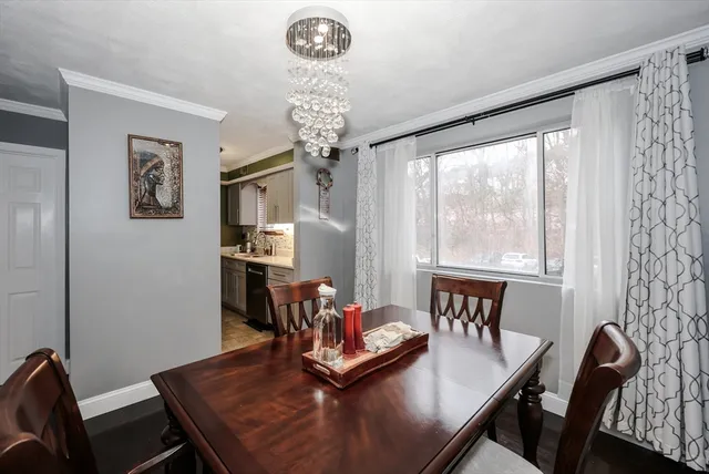 a kitchen with a sink cabinets and window
