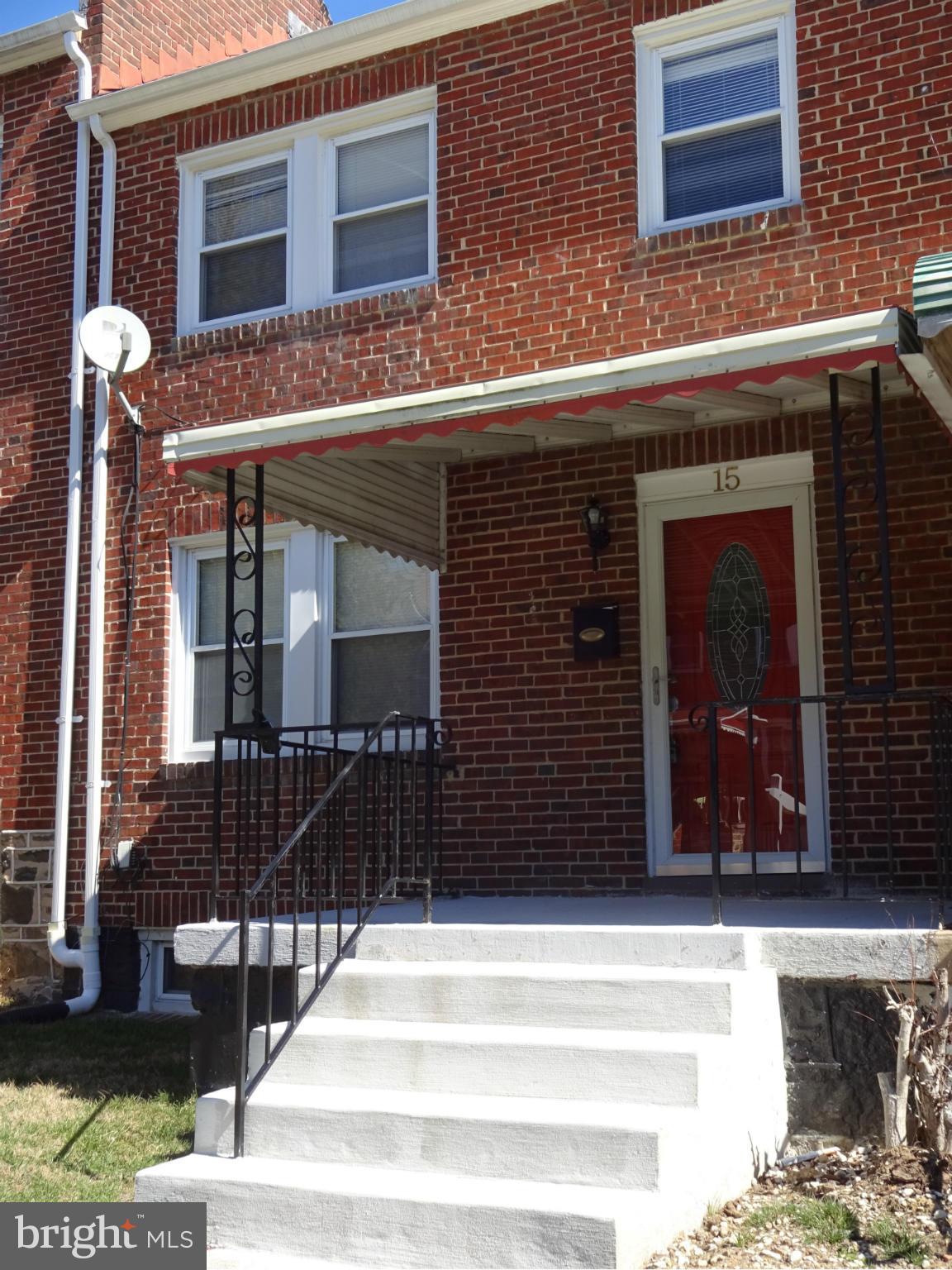 15 South Rosedale Street Baltimore, MD 21229 - Photo 1 of 5 a front view of a house with a garage