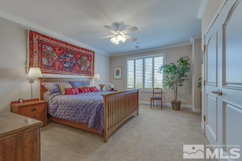 20 Hawken Road Reno, NV 89519 - Photo 18 of 26 a bedroom with a bed and a chandelier