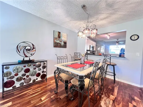 a kitchen with stainless steel appliances granite countertop a refrigerator a stove top oven a sink and dishwasher