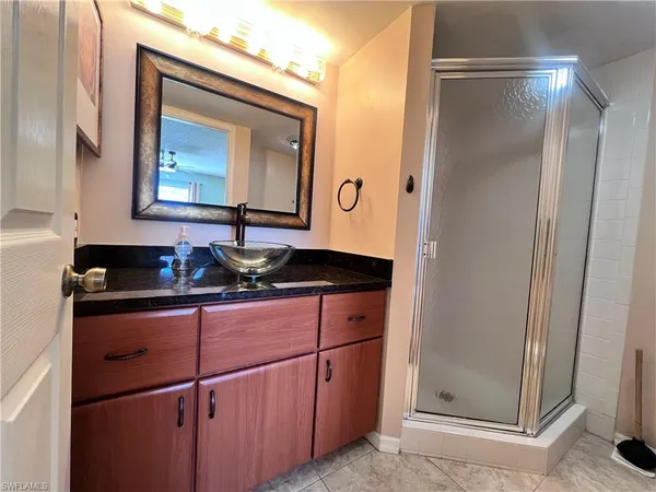 a bed room with a bed and a lamp