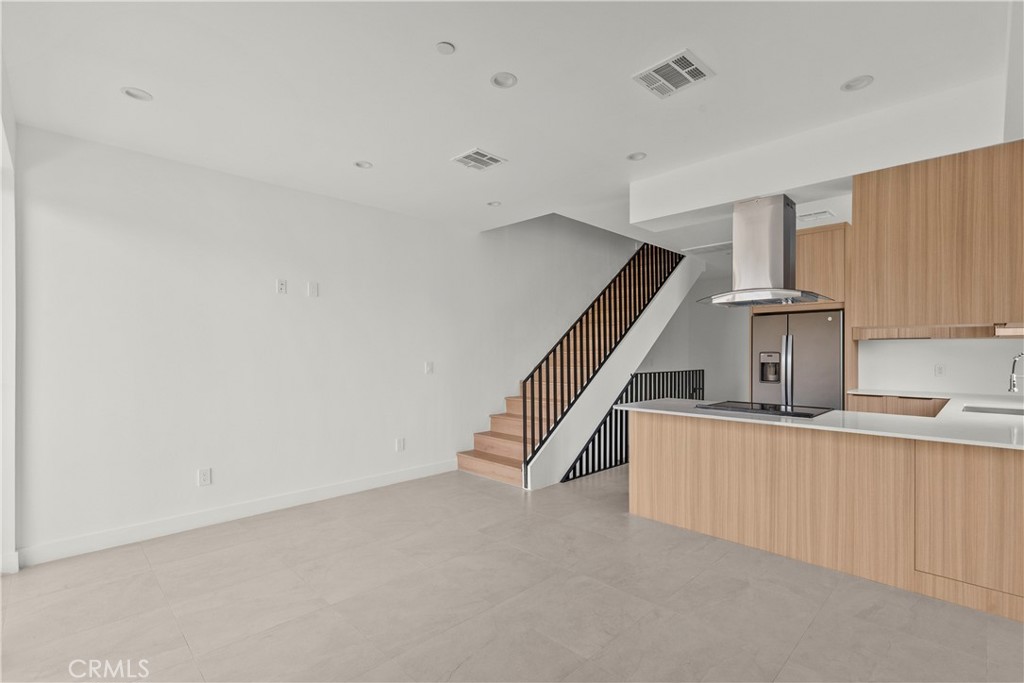 13942 Vanowen Street Van Nuys, CA 91405 - Photo 7 of 21 a room with stairs and windows