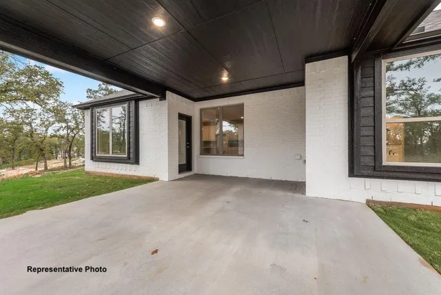 a view of an empty room with a balcony