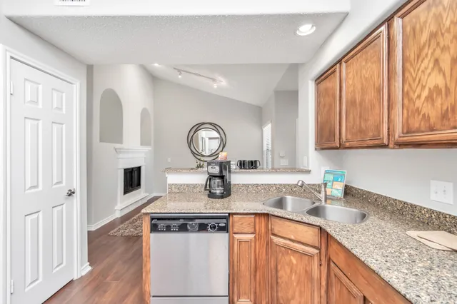 a kitchen with a refrigerator and a window