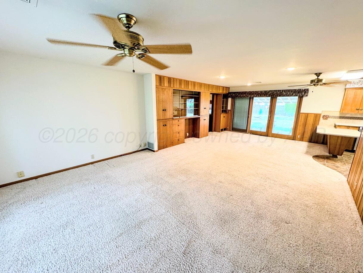 1709 South Eton Street Perryton, TX 79070 - Photo 2 of 22 a large white bed in a room