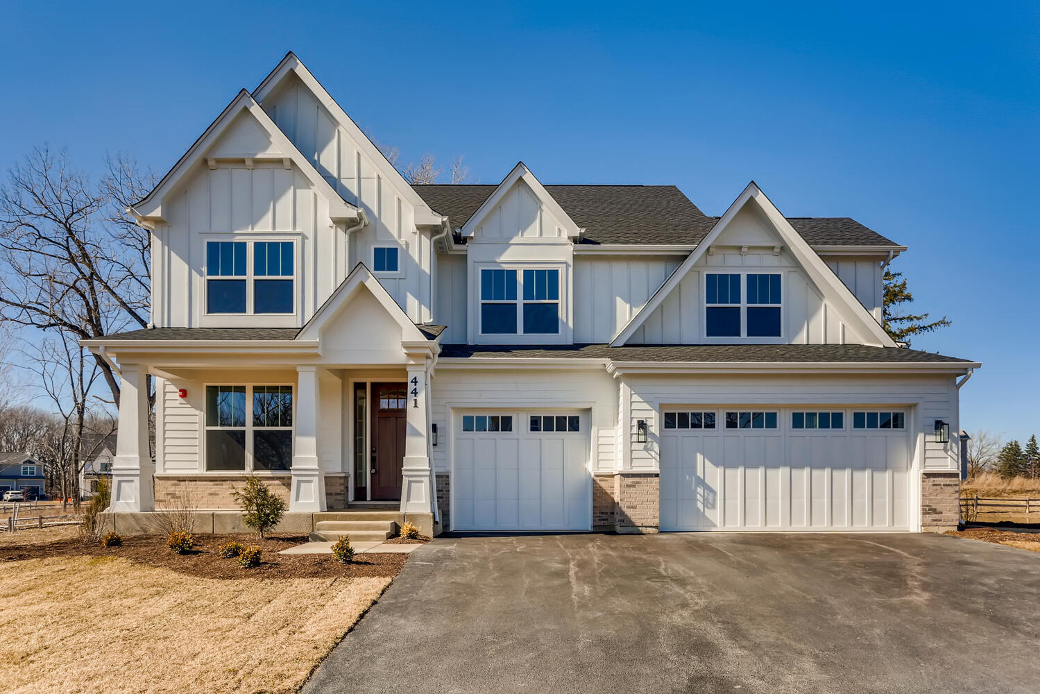 21377 West Sylvan Drive Mundelein, IL 60060 - Photo 1 of 13 a front view of a house with a yard and garage