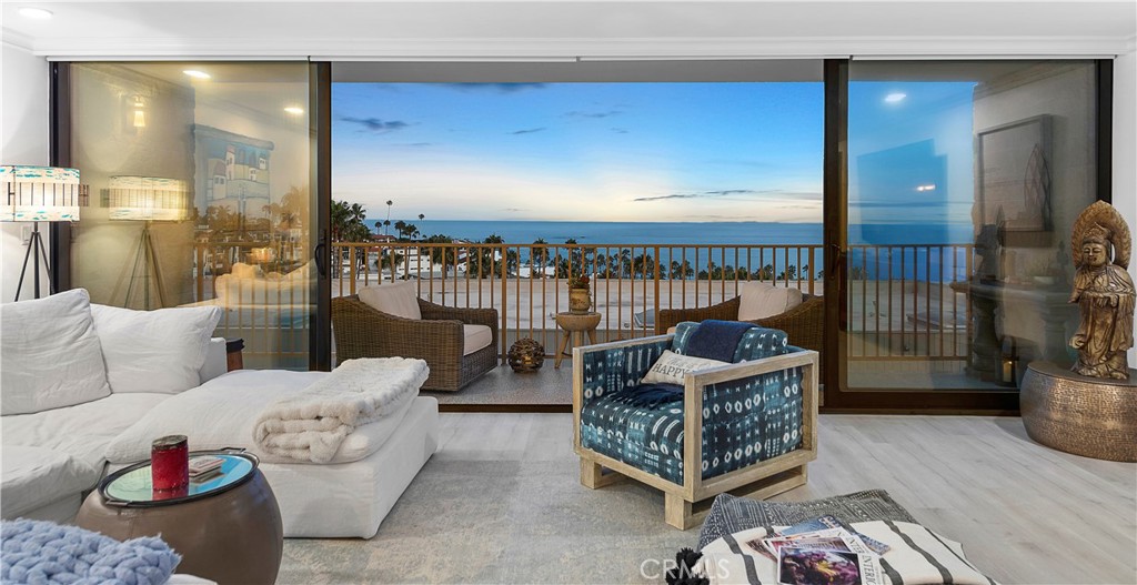 a living room with furniture and a lamp